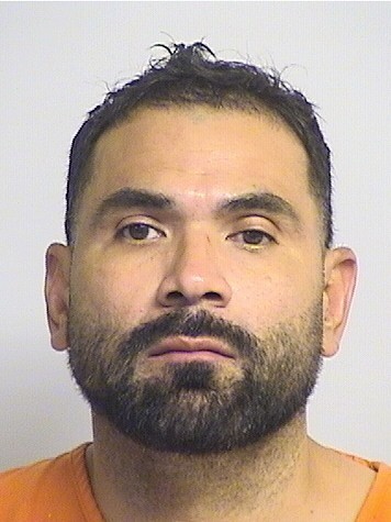 mugshot of Dela Cruz